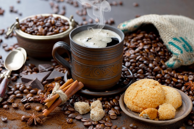 Coffee in a cup on coffee beans