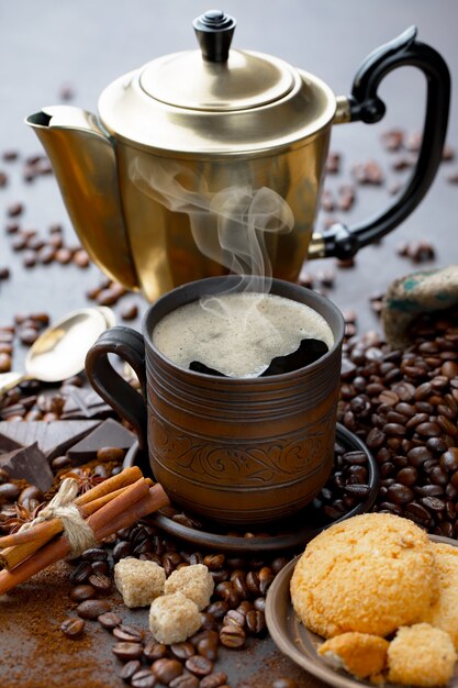 Coffee in a cup on coffee beans