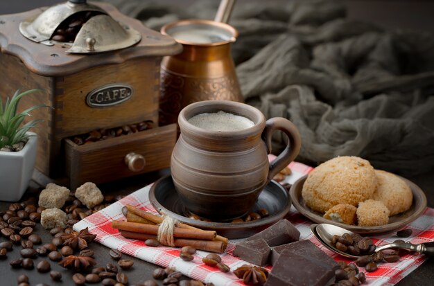 Coffee in a cup on coffee beans