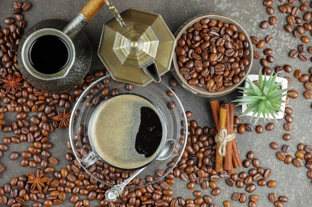 Coffee in a cup on coffee beans