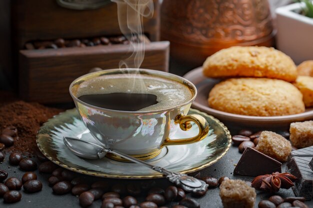 Coffee in a cup on coffee beans