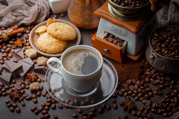 Coffee in a cup on coffee beans