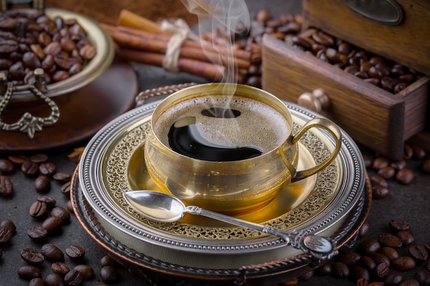 Coffee in a cup on coffee beans