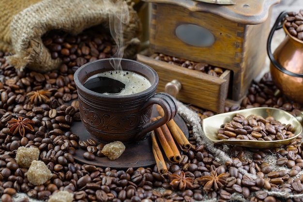 Coffee in a cup on coffee beans