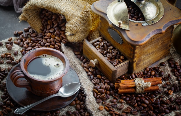 Coffee in a cup on coffee beans