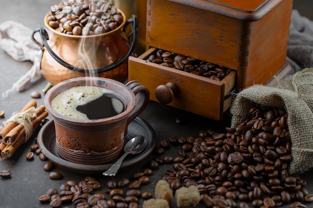 Coffee in a cup on coffee beans