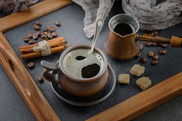 Coffee in a cup on coffee beans