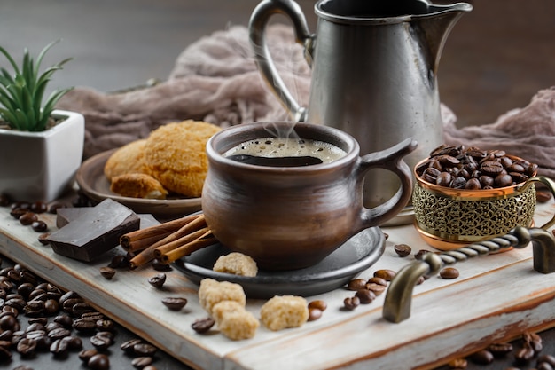 Coffee in a cup on coffee beans