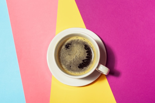 Coffee cup at colorful background