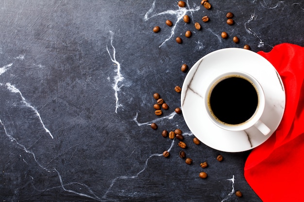 Coffee cup on a dark marble 