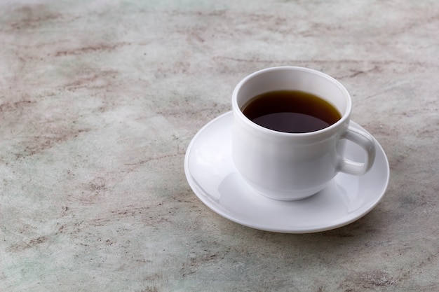 Coffee cup on a marble table copy space