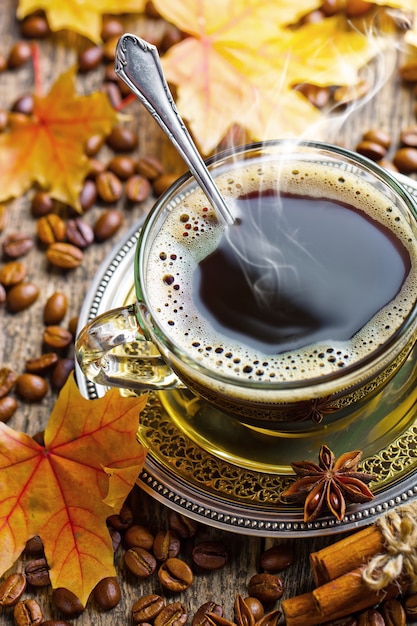 Coffee in a cup on an old background.