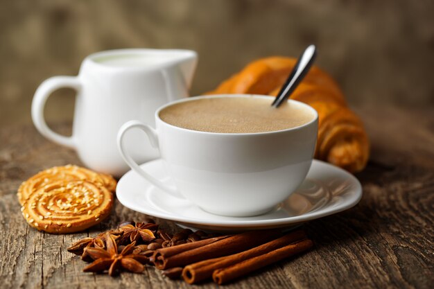 Coffee in a cup on an old background.