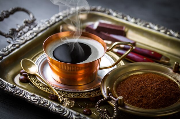 Coffee in a cup on an old surface