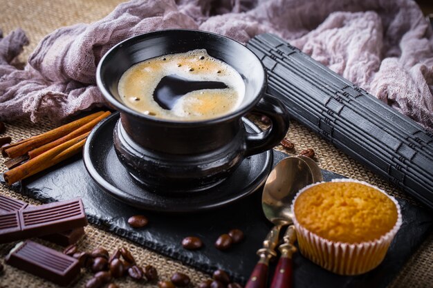 Coffee in a cup on an old table.