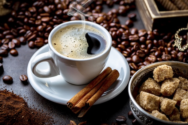 Coffee in a cup on an old table.