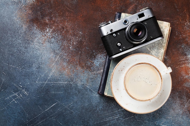 Coffee cup and retro camera