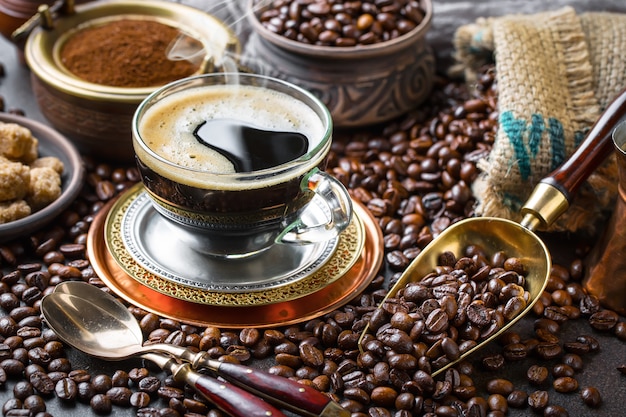 Coffee in a cup and saucer on an old background