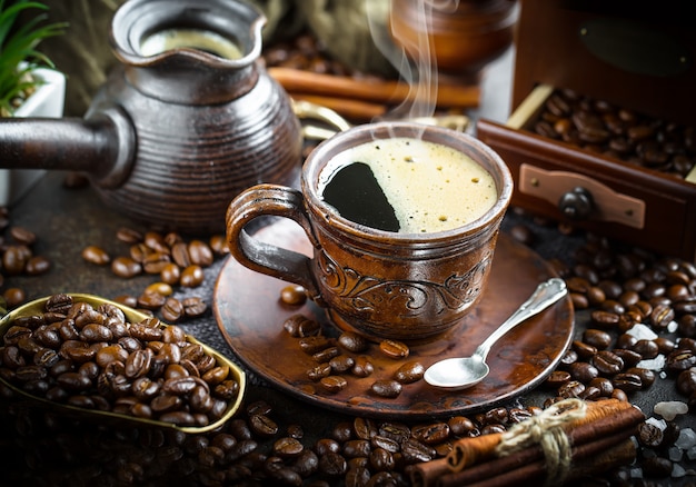 Coffee in a cup and saucer on an old background