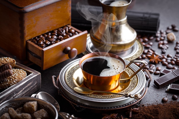 Coffee in a cup and saucer on an old background