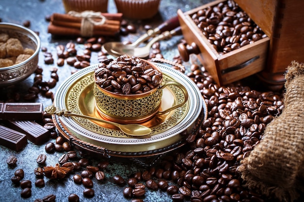 Coffee in a cup and saucer on an old background.