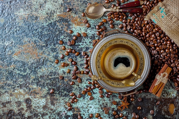 Coffee in a cup and saucer on an old background