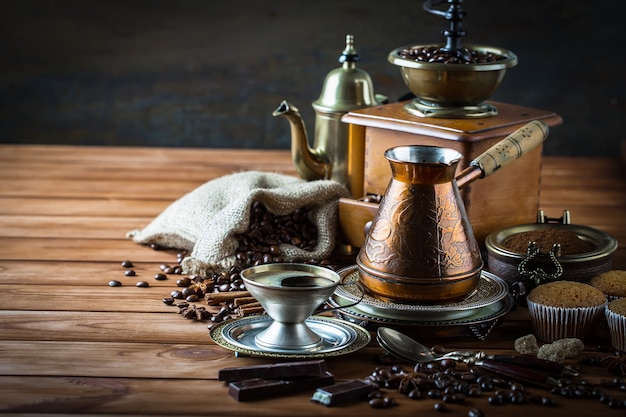 Coffee in a cup and saucer on an old background