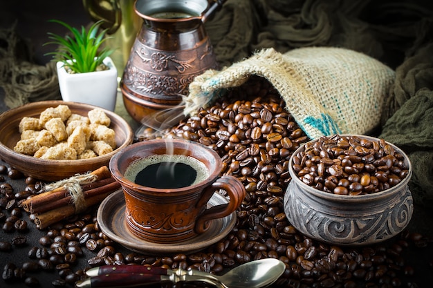 Coffee in a cup and saucer on an old background