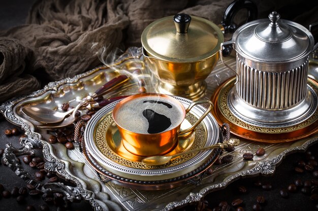 Coffee in a cup and saucer on an old.