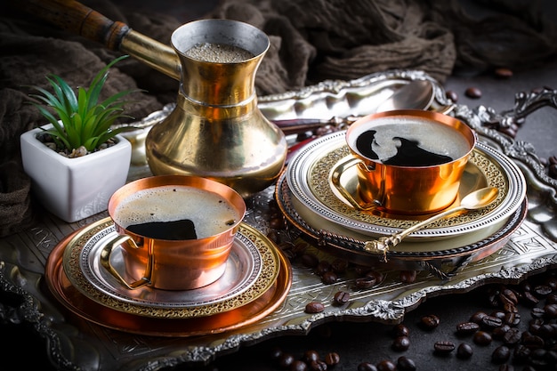 Coffee in a cup and saucer on an old.