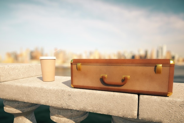 Coffee cup and suitcase