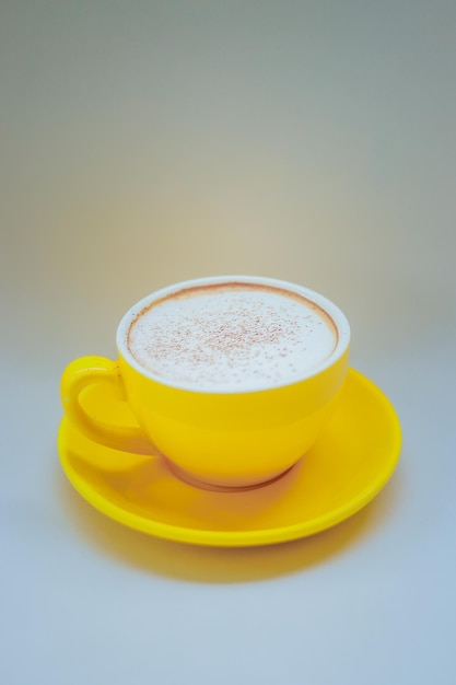 Coffee cup on table against white background