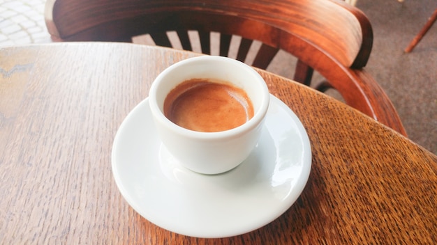 Coffee cup on the table at a cafe