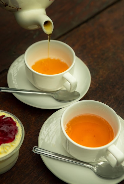 Coffee cup and tea on table