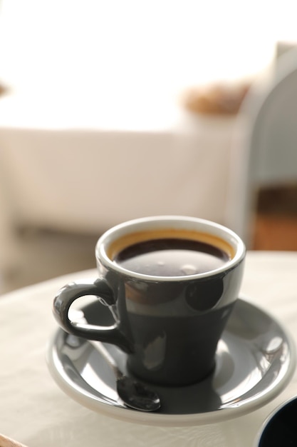 Coffee cup in white table