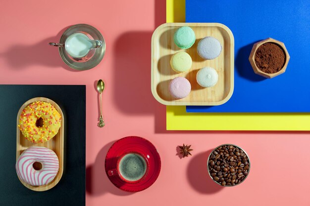 Coffee in a cup with dessert on a bright colored background