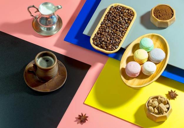 Coffee in a cup with dessert on a bright colored background