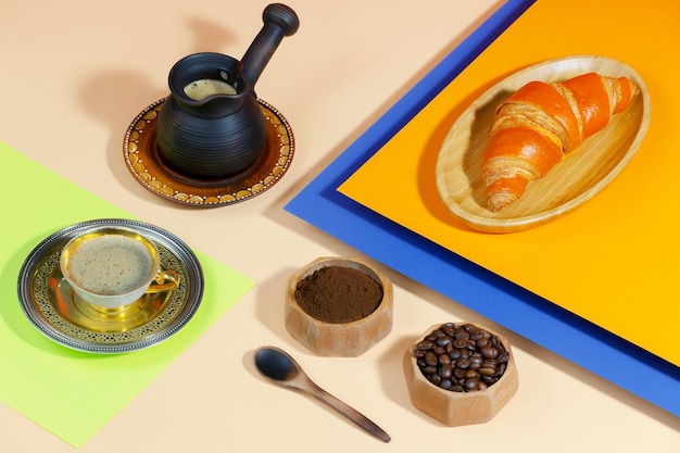 Coffee in a cup with dessert on a bright colored background