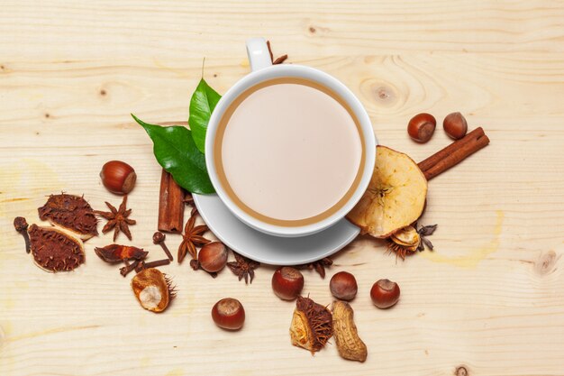 Coffee cup with saucer on a wooden top view