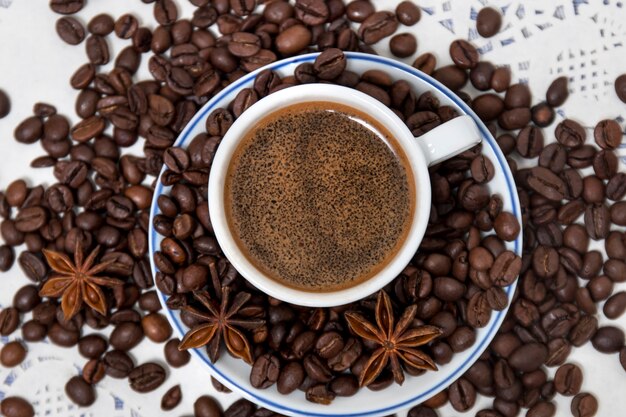 Coffee cup with spreaded beans