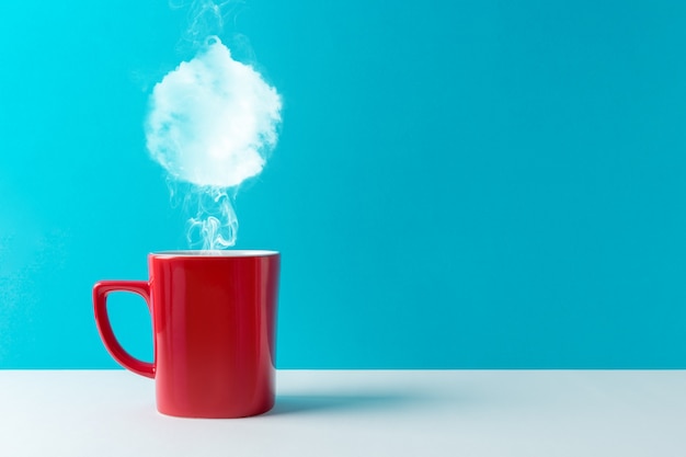 Coffee cup with steam shaped of Christmas bauble decoration