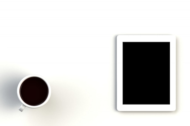 白い背景の上のタブレットとコーヒーカップ