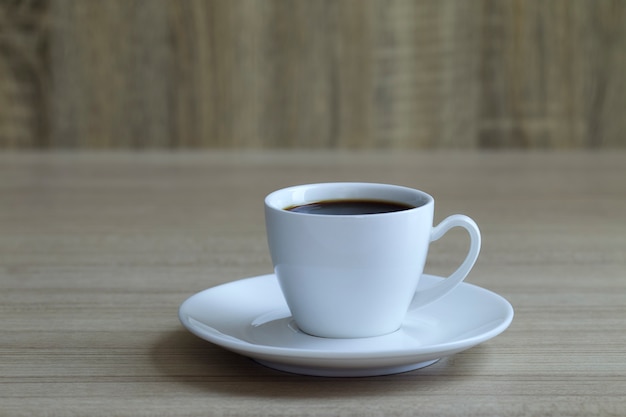 Coffee cup on wood background