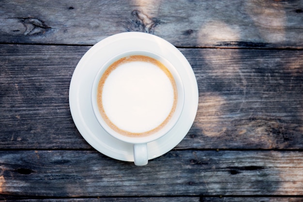 Coffee cup on wood.