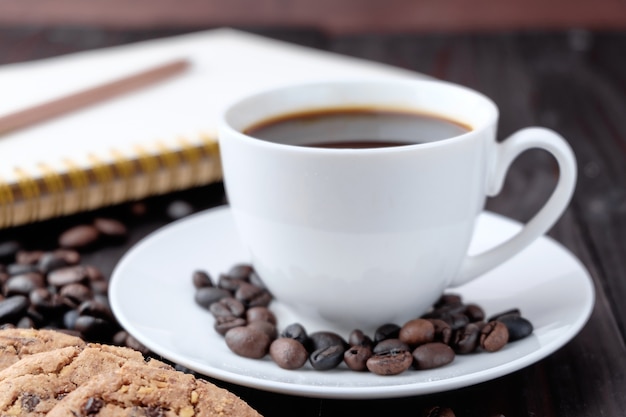 Coffee cup on wooden background