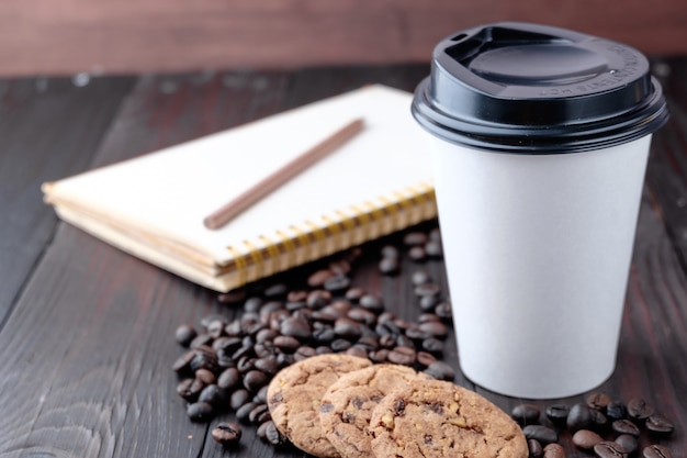 Coffee cup on wooden background