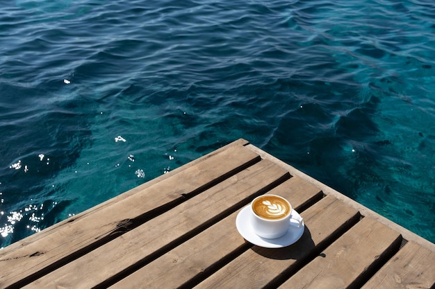 Coffee cup on wooden floor