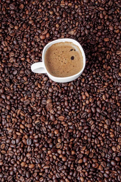 Coffee cup on wooden table. View from top