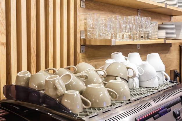 Coffee cups on the coffee machine in the elite popular bar