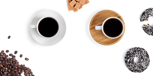 Coffee cups and sweets on a white background